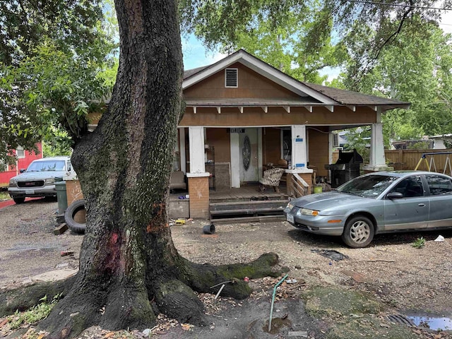 4010 Howard St, Beaumont, TX 77705 - view of front of property featuring covered porch and fence
