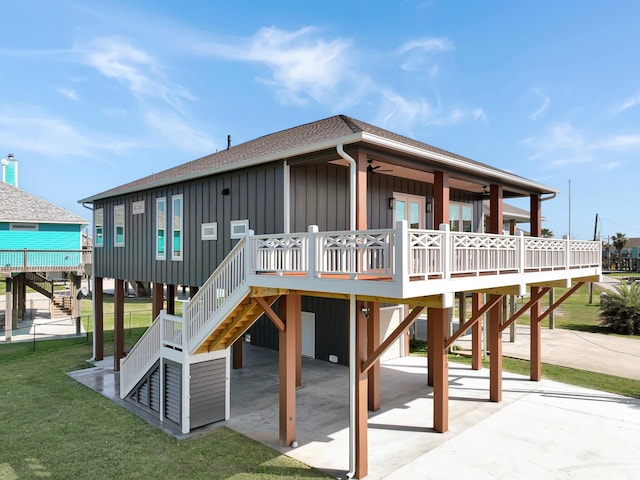 view of play area with a yard and ceiling fan