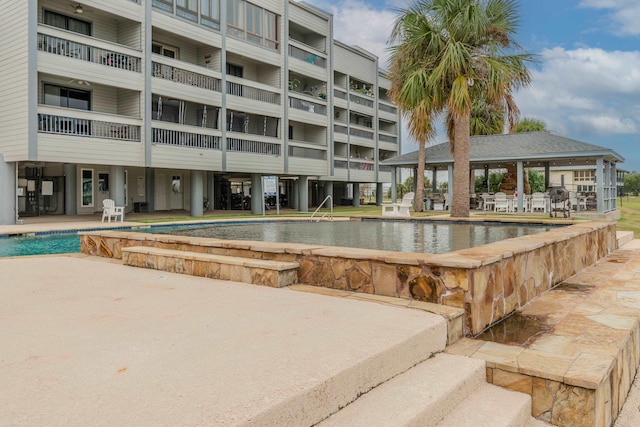 580 Pleasure Island Island, Port Arthur, TX 77640 - view of pool featuring a gazebo, an infinity pool, and a patio