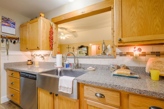 kitchen with stainless steel dishwasher, ceiling fan, sink, and tasteful backsplash