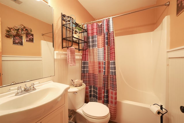 full bathroom with vanity, toilet, and shower / tub combo with curtain