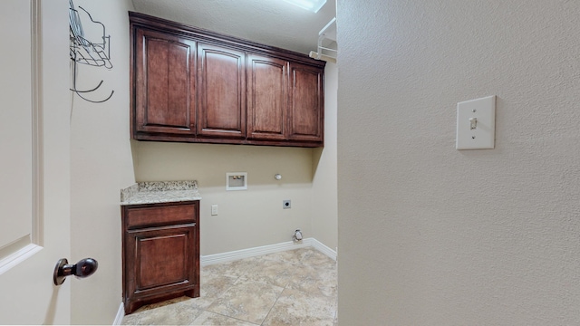 laundry room with cabinet space, baseboards, hookup for a gas dryer, hookup for an electric dryer, and washer hookup