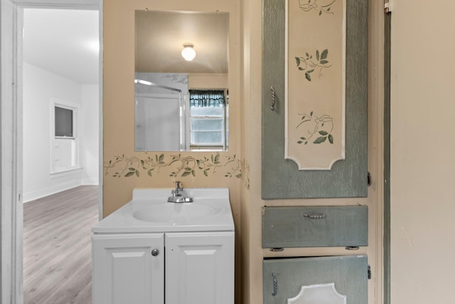 bathroom featuring vanity and wood finished floors