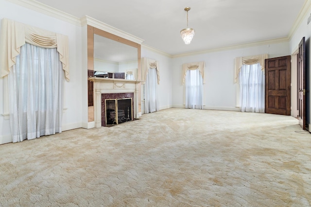 unfurnished living room featuring a premium fireplace, crown molding, and light carpet