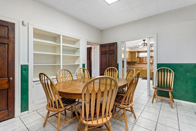 dining room with ceiling fan and light tile patterned floors