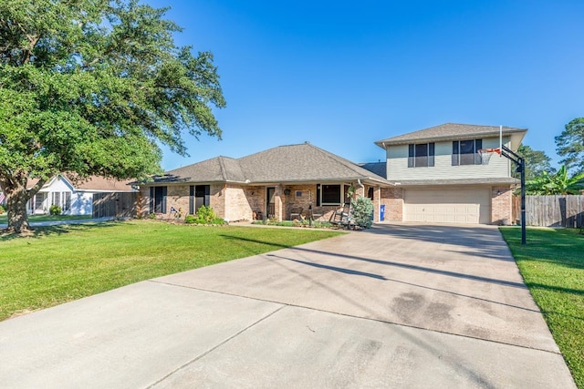 view of front of house with a garage and a front yard