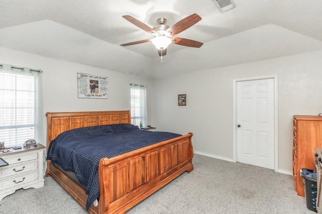 carpeted bedroom with multiple windows, ceiling fan, and a textured ceiling