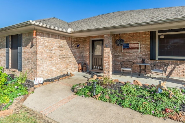 entrance to property featuring covered porch