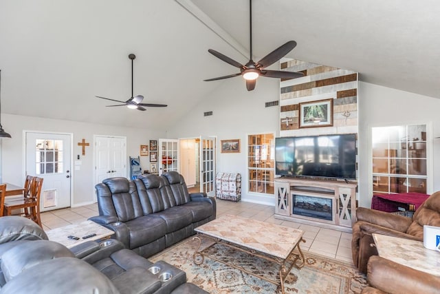 tiled living room featuring high vaulted ceiling and ceiling fan