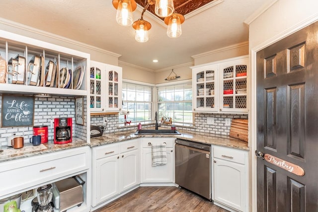 kitchen with white cabinets, dishwasher, crown molding, and sink