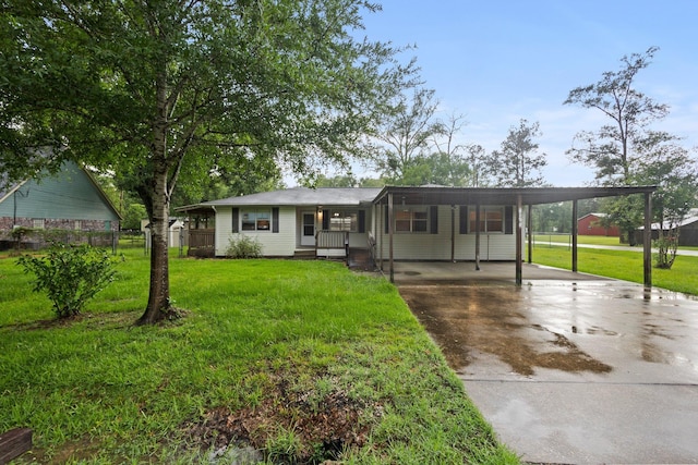 8598 Cornell Dr, Lumberton, TX 77657 - view of front of house with concrete driveway and an attached carport