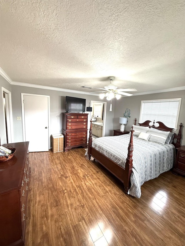 bedroom featuring a ceiling fan, a textured ceiling, ornamental molding, and wood finished floors