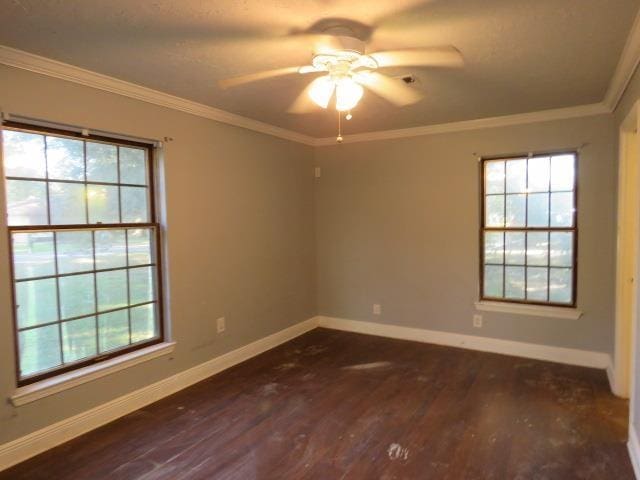 unfurnished room with ceiling fan, dark hardwood / wood-style floors, a healthy amount of sunlight, and crown molding