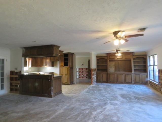 unfurnished living room with ceiling fan