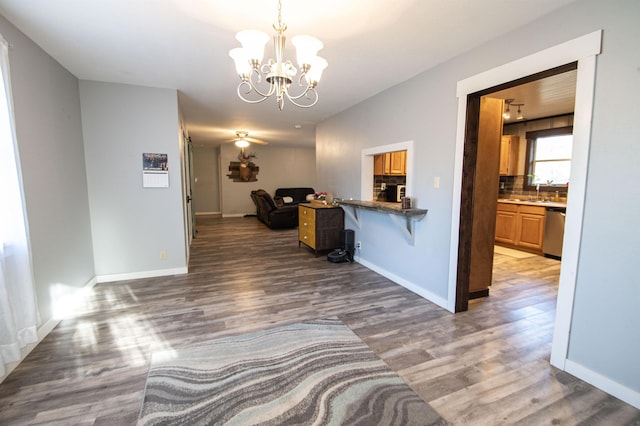 hallway featuring a notable chandelier and dark hardwood / wood-style flooring