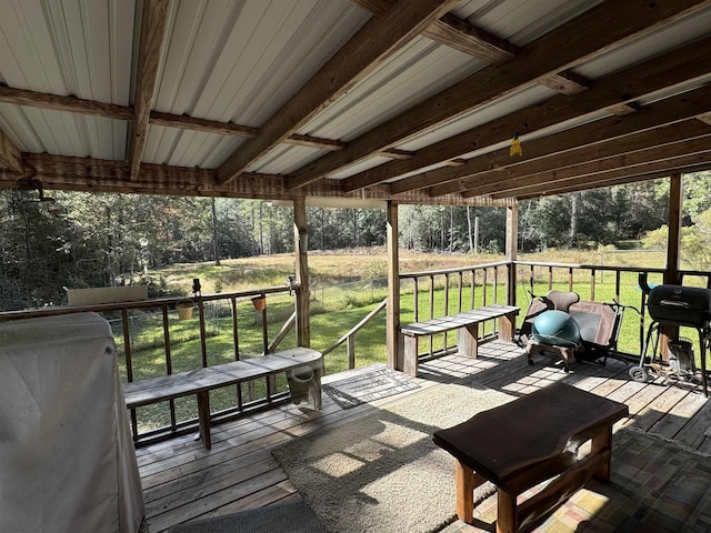 wooden deck with a grill and a yard