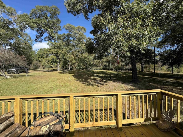 wooden terrace with a yard