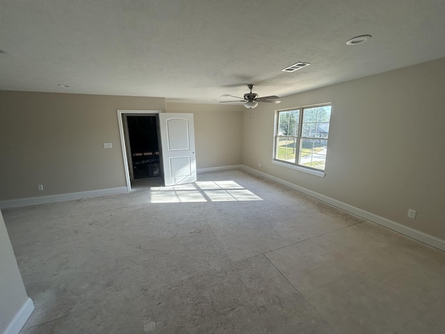 unfurnished bedroom with a ceiling fan, visible vents, and baseboards