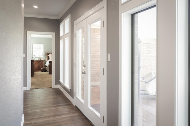 5200 N Fm 105, Vidor, TX 77662 - doorway with crown molding, dark wood-type flooring, baseboards, and recessed lighting