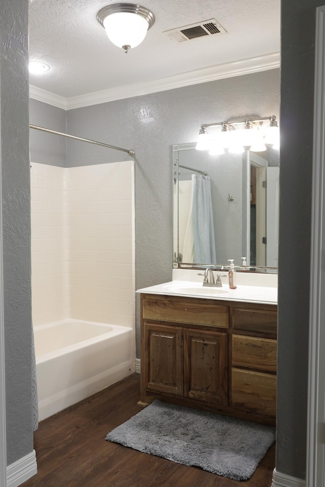 5200 N Fm 105, Vidor, TX 77662 - bathroom featuring a textured wall, crown molding, wood finished floors, a textured ceiling, and vanity