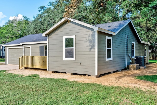 exterior space featuring a yard and a garage