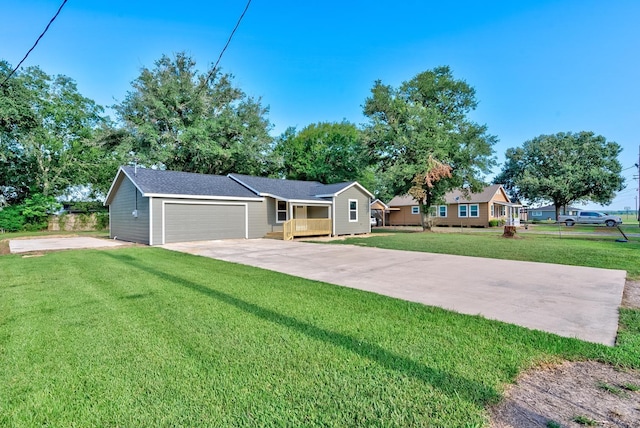 single story home with a front yard and a garage