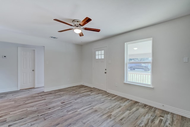 foyer featuring light wood-type flooring and ceiling fan