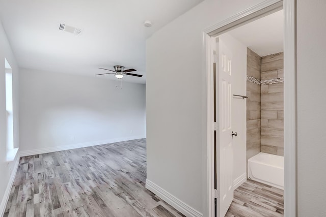 hallway featuring light hardwood / wood-style flooring