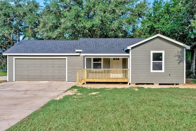 ranch-style home with a front yard, a garage, and covered porch