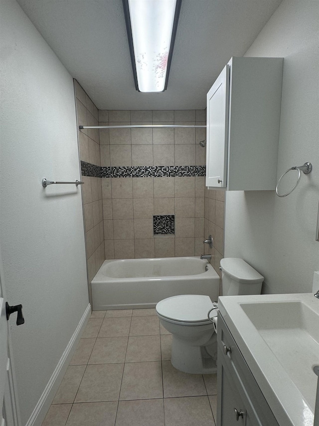 full bathroom featuring tile patterned floors, vanity, toilet, and tiled shower / bath