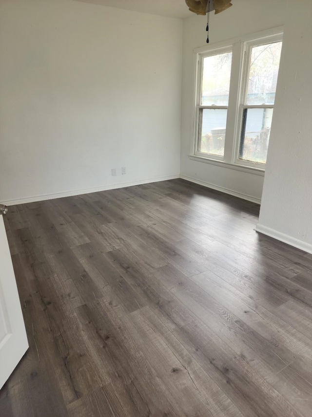 empty room with dark hardwood / wood-style floors