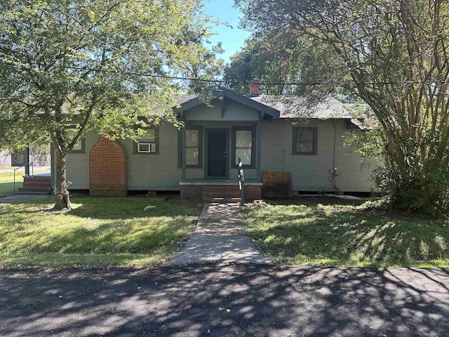 bungalow with a front yard