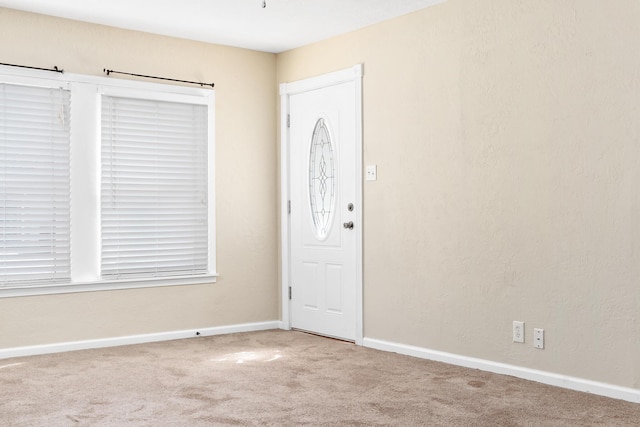 entryway featuring carpet floors