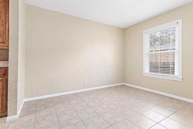 empty room featuring light tile patterned flooring