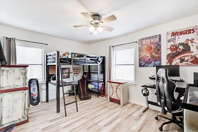 bedroom featuring light wood-type flooring and ceiling fan