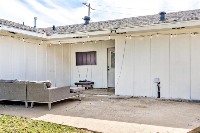 entrance to property featuring an outdoor hangout area and a patio area