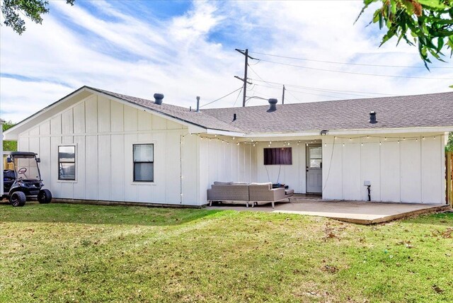 back of property featuring outdoor lounge area, a yard, and a patio area