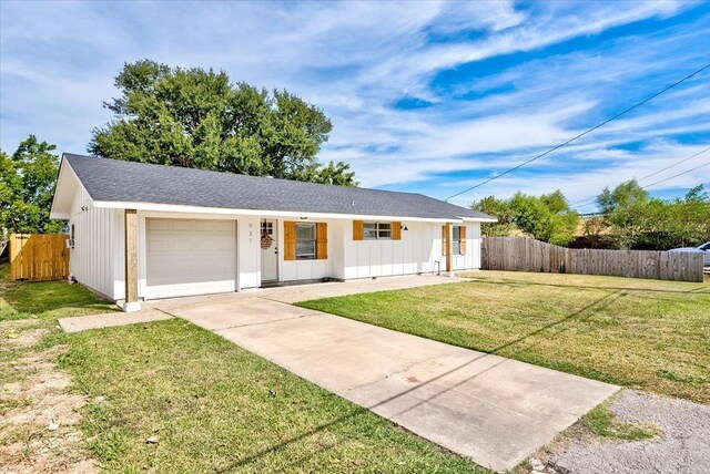 ranch-style home with a front yard and a garage