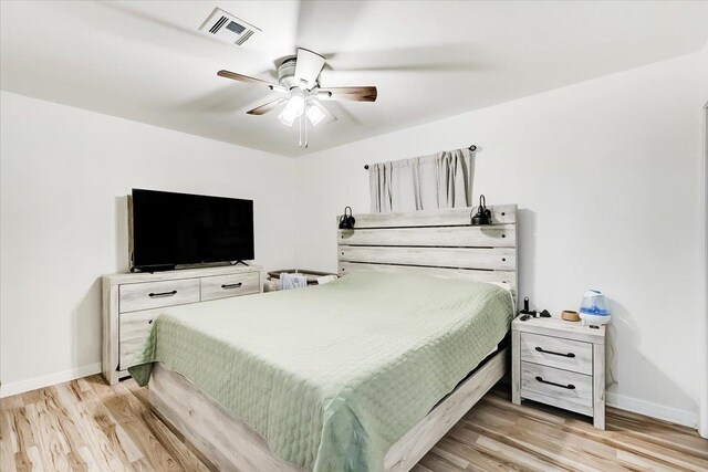 bedroom featuring light wood-type flooring and ceiling fan