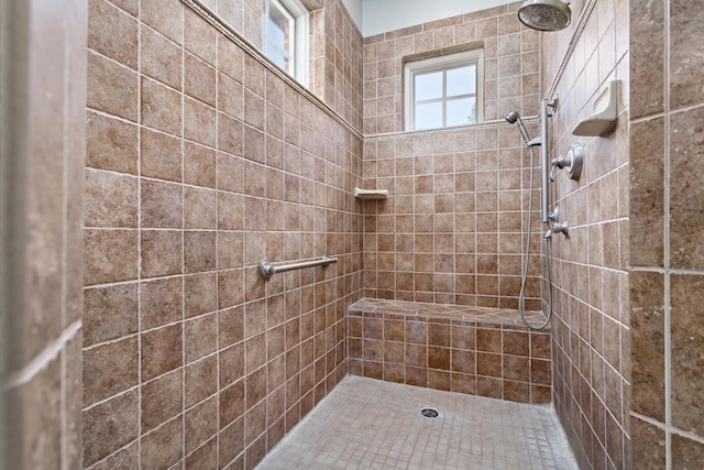 bathroom featuring tiled shower