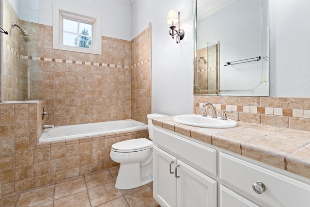 full bathroom with vanity, toilet, and tiled shower / bath combo