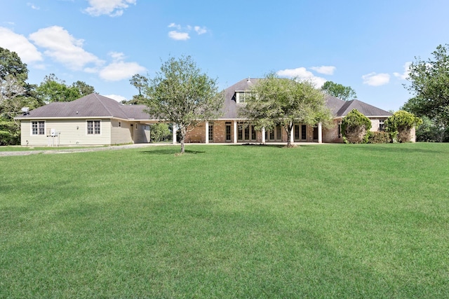 exterior space with a yard