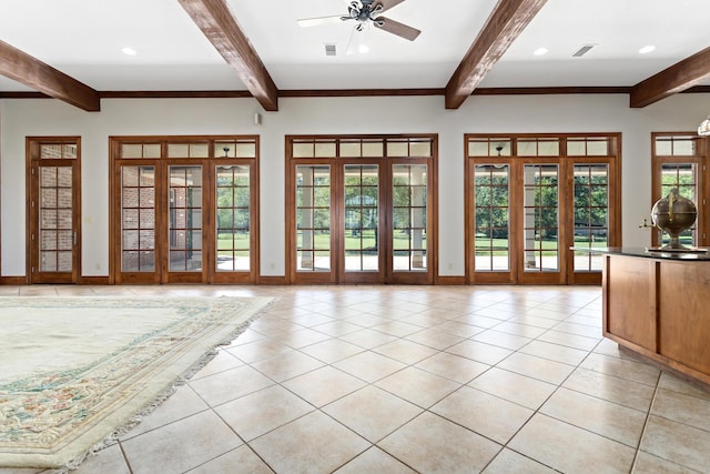 interior space featuring beam ceiling, ceiling fan, and light tile patterned flooring