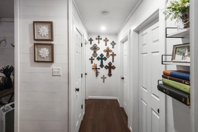 hall featuring dark hardwood / wood-style floors and ornamental molding