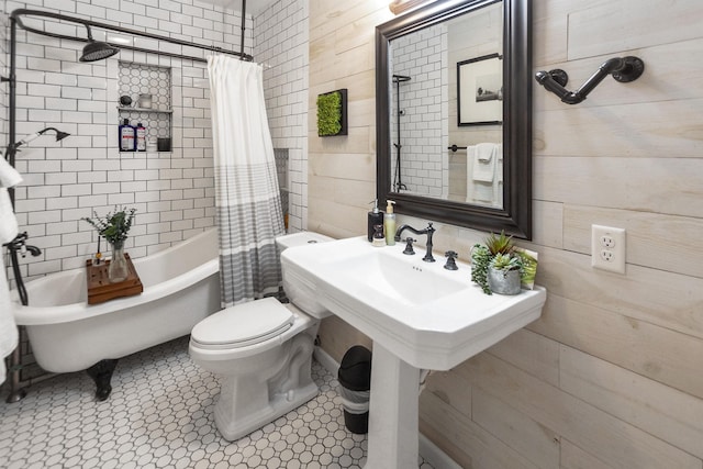 bathroom featuring tile patterned flooring, shower / bath combo, and toilet