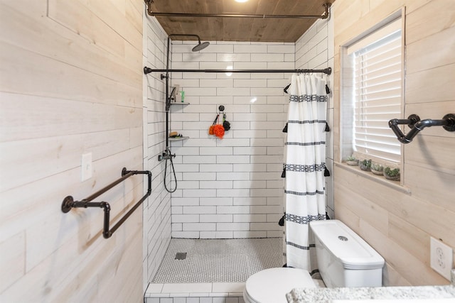 bathroom with a shower with curtain, wood walls, wood ceiling, and toilet