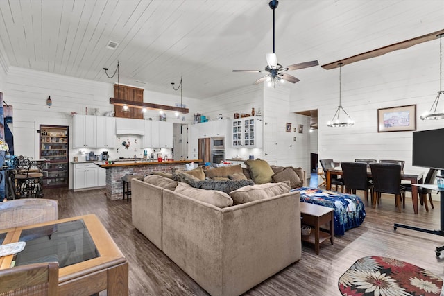 living room featuring ceiling fan and hardwood / wood-style flooring