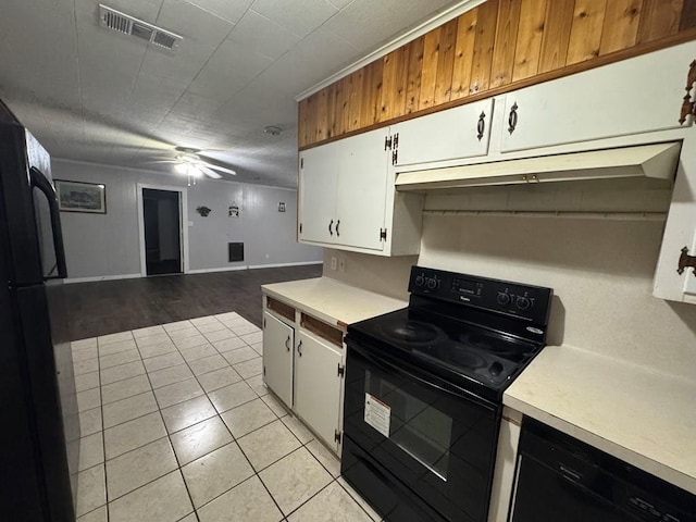 kitchen featuring light tile patterned floors, white cabinetry, ceiling fan, and black appliances