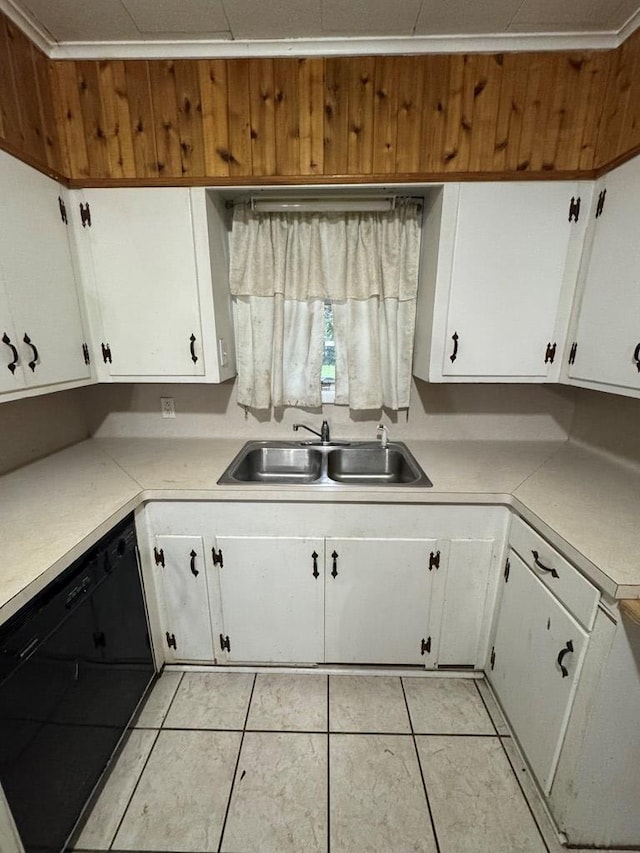 kitchen featuring dishwasher, white cabinets, light tile patterned flooring, and sink