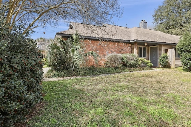 view of property exterior featuring a lawn